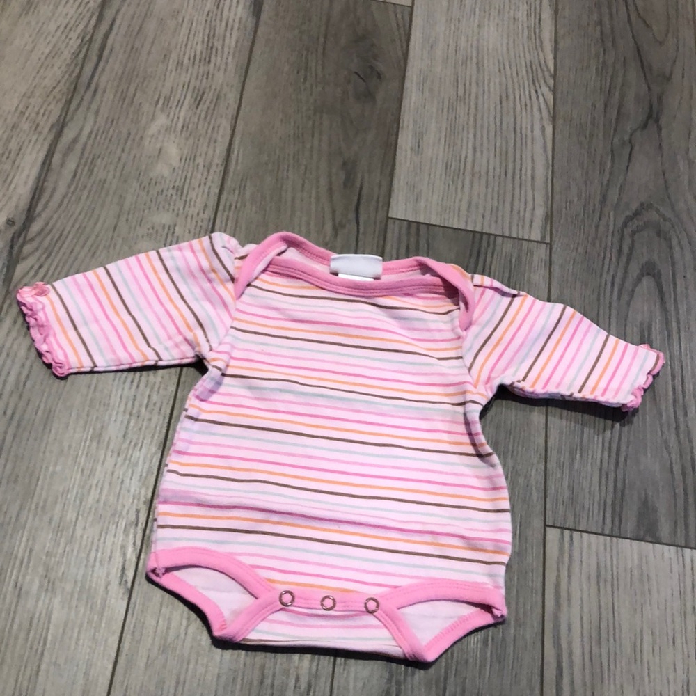 Girl size 0-3 months Onesie in good used condition